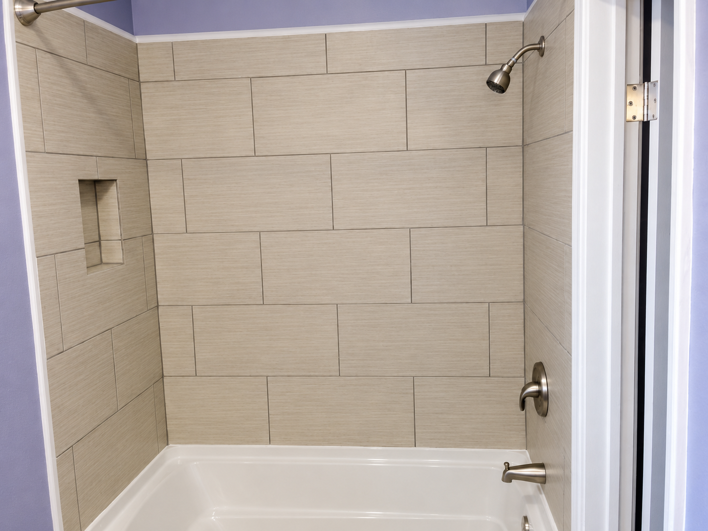 Finished tiled tub surround with built-in niche