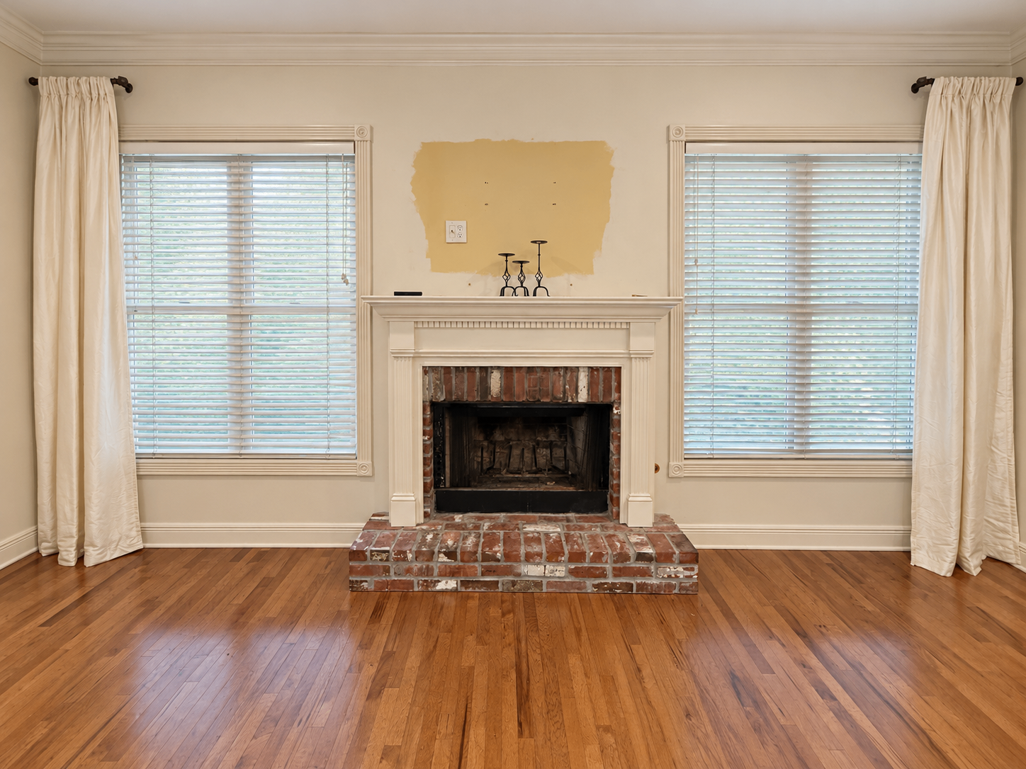 Brick fireplace before its finish carpentry update